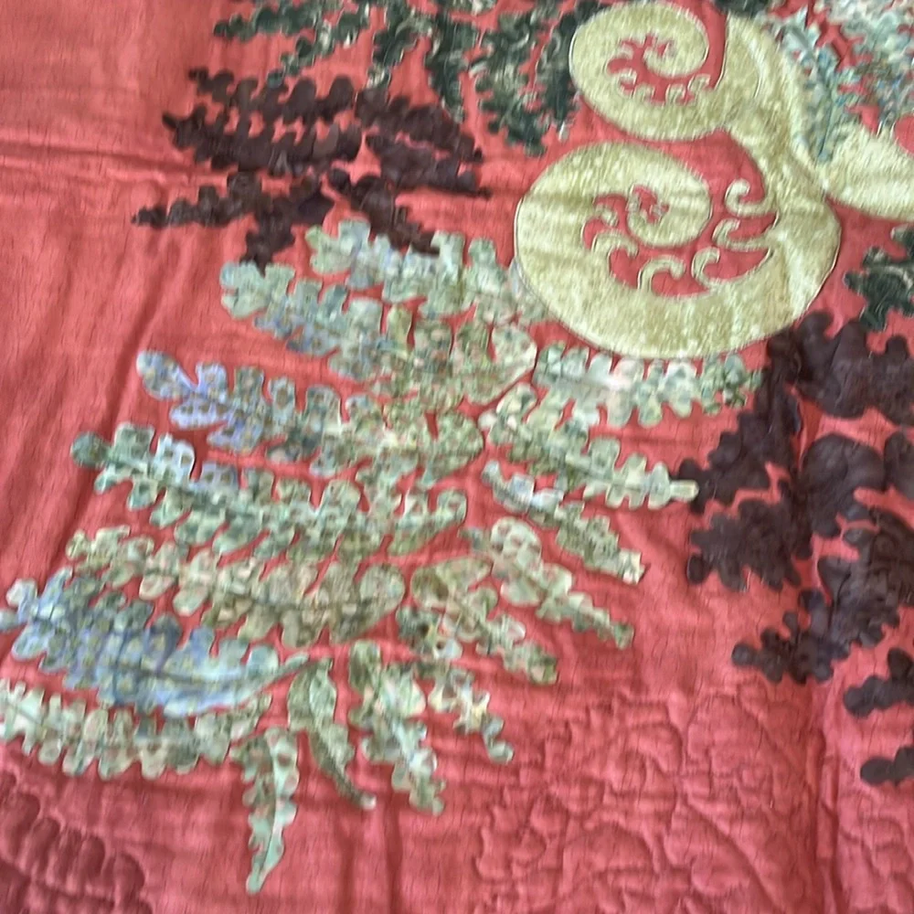 Beautiful terra cotta and green quilt wall hanging. Homemade.